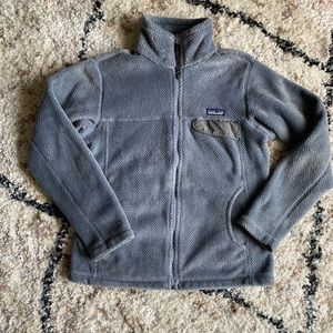 Grey fuzzy Patagonia zip up jacket.